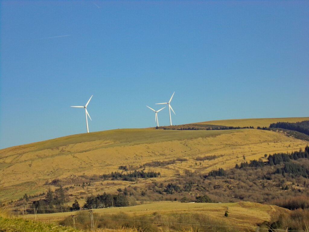 Decorative Image of Windmills on a hill